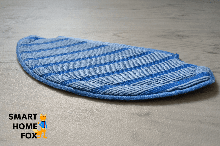The blue cleaning cloth of the OZMO T8 AIVI lies on the floor
